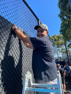 Image of our National Location Manager, JR, installing BindiMaps weatherproof beacons at the Australian Open.