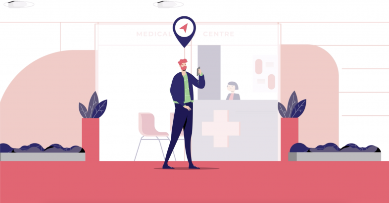 Colourful blue and red and white illustration of a jaunty looking man holding a phone and standing in front of a medical centre reception desk. The ground is a light red, and he is in all blue and looks happy to have found the place using BindiMaps!